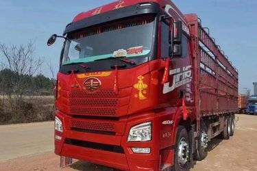 二手青岛解放 JH6重卡 460马力 8X4 9.5米仓栅式载货车(自动挡)(国五) 前四后八 潍柴二手载货车 黄牌图片