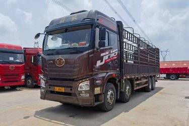 二手青岛解放 JH6重卡 460马力 8X4 9.4米AMT自动挡仓栅式载货车(速比3.545)(国五) 前四后八 潍柴二手载货车 黄牌图片