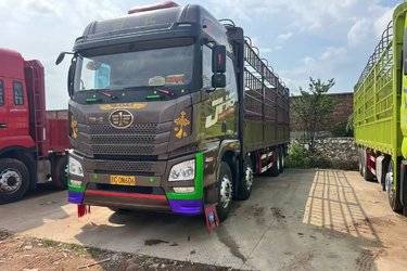 二手青岛解放 JH6重卡 460马力 8X4 9.4米仓栅式载货车(国五) 前四后八 锡柴二手载货车 黄牌