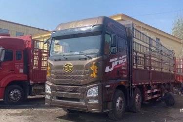 二手青岛解放 JH6重卡 领航版 460马力 8X4 9.5米AMT自动挡仓栅式载货车(国五) 前四后八 锡柴二手载货车 黄牌图片