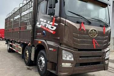 二手青岛解放 JH6重卡 320马力 6X2 9.5米仓栅式载货车(国五) 前四后四 锡柴二手载货车 黄牌图片