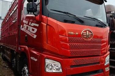 二手青岛解放 JH6重卡 460马力 8X4 9.5米仓栅式载货车(潍柴发动机)(国五) 前四后八 潍柴二手载货车 黄牌图片