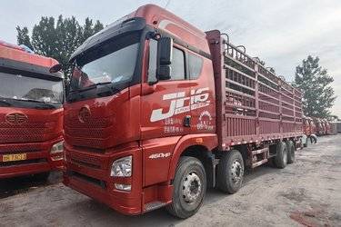 二手青岛解放 JH6重卡 460马力 8X4 9.5米仓栅式载货车(一汽12挡)(国五) 前四后八 锡柴二手载货车 黄牌图片
