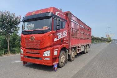 二手青岛解放 JH6重卡 领航版2.0 460马力 8X4 9.4米仓栅式载货车(国五) 前四后八 锡柴二手载货车 黄牌图片