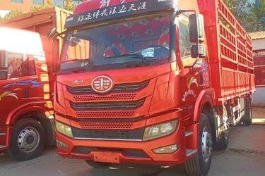 青岛解放 悍V重卡 290马力 6X2 7.7米仓栅式载货车(国五) 前四后四 锡柴二手载货车 黄牌