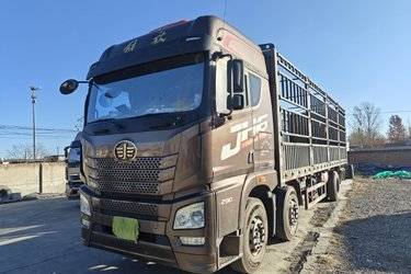 二手青岛解放 JH6重卡 290马力 6X2 9.5米仓栅式载货车(国五) 前四后四 锡柴二手载货车 黄牌