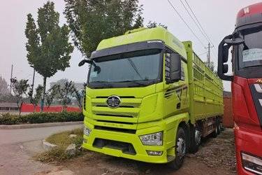 二手一汽解放 J7重卡 经典版 560马力 8X4 9.4米AMT自动档仓栅式载货车(带液缓)(国六) 前四后八 锡柴二手载货车 黄牌图片