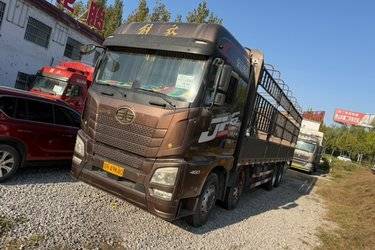 二手青岛解放 JH6重卡 领航版2.0 460马力 8X4 9.5米仓栅式载货车(国五) 前四后八 锡柴二手载货车 黄牌图片