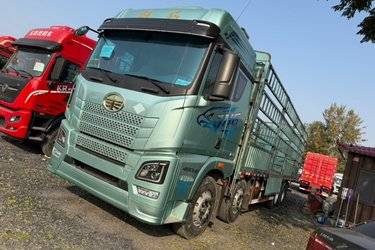 二手青岛解放 JH6 智享版 480马力 8X4 9.4米LNG自动档仓栅式载货车(国六) 前四后八 锡柴二手载货车 黄牌图片