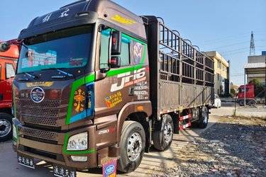 二手青岛解放 JH6重卡 卓越版2.0 290马力 6X2 7.6米仓栅式载货车(国五) 前四后四 锡柴二手载货车 黄牌