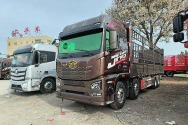 二手青岛解放 JH6重卡 460马力 8X4 9.4米仓栅式载货车(速比3.727)(国六) 前四后八 锡柴二手载货车 黄牌图片