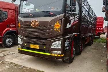 二手青岛解放 JH6重卡 400马力 8X4 9.5米仓栅式载货车(国五) 前四后八 锡柴二手载货车 黄牌