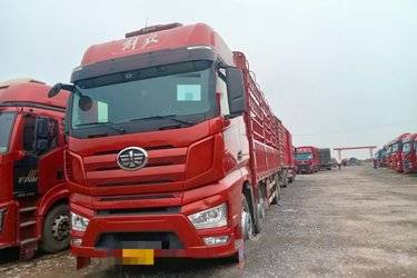 二手一汽解放 J7重卡 460马力 8X4 9.4米仓栅式载货车(国六) 前四后八 锡柴二手载货车 黄牌图片