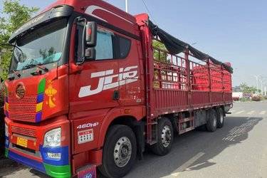 二手青岛解放 JH6重卡 领航版2.0 460马力 8X4 9.5米仓栅式载货车(国五) 前四后八 锡柴二手载货车 黄牌图片