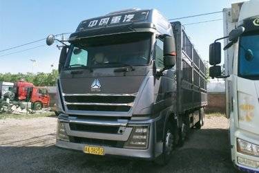 二手中国重汽 HOWO TH7重卡 500马力 8X4 9.5米仓栅式载货车(国六) 前四后八 曼二手载货车 黄牌图片