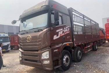 二手青岛解放 JH6重卡 290马力 6X2 9.5米仓栅式载货车(国五) 前四后四 锡柴二手载货车 黄牌