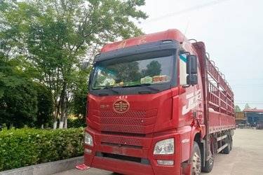 二手青岛解放 JH6重卡 领航版2.0 420马力 8X4 9.4米仓栅式载货车(国五) 前四后八 锡柴二手载货车 黄牌图片
