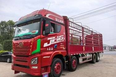 二手青岛解放 JH6重卡 智尊版2.0 460马力 8X4 9.4米仓栅式载货车(国五) 前四后八 锡柴二手载货车 黄牌图片