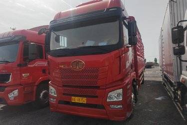 二手青岛解放 JH6重卡 320马力 6X2 9.5米仓栅式载货车(国六) 前四后四 锡柴二手载货车 黄牌