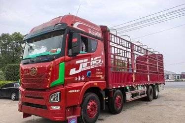 二手青岛解放 JH6重卡 智尊版2.0 460马力 8X4 9.4米仓栅式载货车(速比3.545)(国五) 前四后八 锡柴二手载货车 黄牌