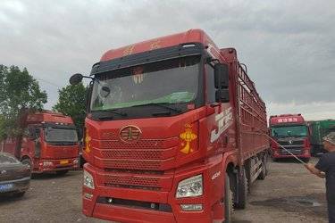 二手青岛解放 JH6重卡 领航版2.0 460马力 8X4 9.4米仓栅式载货车(国六) 前四后八 锡柴二手载货车 黄牌
