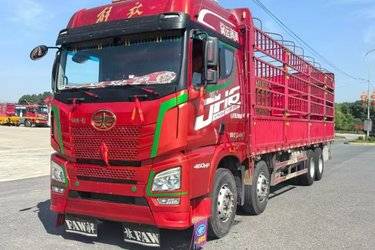 二手青岛解放 JH6重卡 460马力 8X4 9.4米仓栅式载货车(速比3.545)(国五) 前四后八 锡柴二手载货车 黄牌