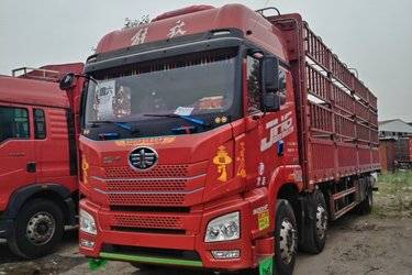 二手青岛解放 JH6重卡 卓越版 320马力 6X2 9.5米仓栅式载货车(国六) 前四后四 锡柴二手载货车 黄牌