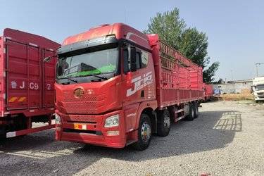 二手青岛解放 JH6重卡 420马力 8X4 9.5米仓栅式载货车(国五) 前四后八 锡柴二手载货车 黄牌