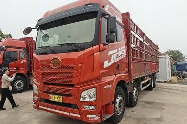 二手青岛解放 JH6重卡 领航版2.0 460马力 8X4 9.5米仓栅式载货车(国五) 前四后八 潍柴二手载货车 黄牌