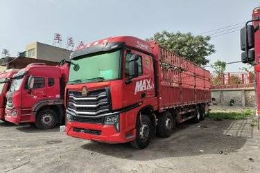 二手中国重汽 HOWO MAX 460马力 8X4 9.5米AMT自动挡仓栅式载货车(国六) 前四后八 潍柴二手载货车 黄牌图片