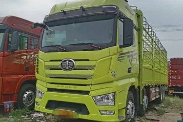 二手一汽解放 J7重卡 460马力 8X4 9.4米仓栅式载货车(国六) 前四后八 锡柴二手载货车 黄牌图片