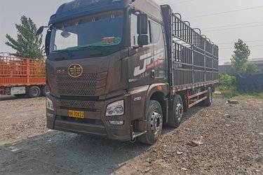 二手青岛解放 JH6重卡 290马力 6X2 9.5米仓栅式载货车(国五) 前四后四 锡柴二手载货车 黄牌