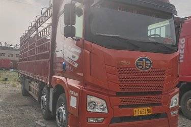 二手青岛解放 JH6重卡 290马力 6X2 9.5米仓栅式载货车(国五) 前四后四 锡柴二手载货车 黄牌