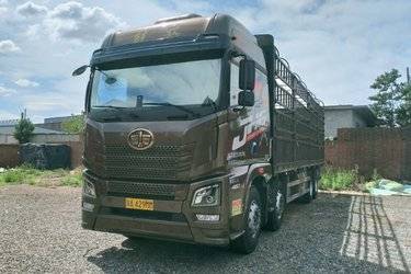 二手青岛解放 JH6重卡 领航版2.0 460马力 8X4 9.5米仓栅式载货车(国五) 前四后八 锡柴二手载货车 黄牌
