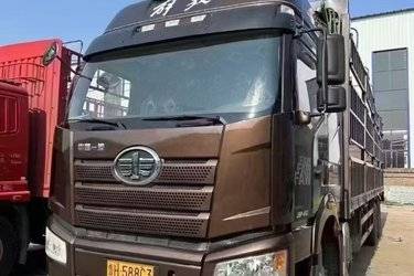 二手一汽解放 新J6P重卡 绿通版 460马力 8X4 9.5米仓栅式载货车(国五) 前四后八 锡柴二手载货车 黄牌图片