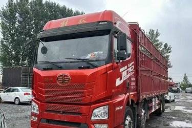 二手青岛解放 JH6重卡 350马力 8X4 9.4米仓栅式载货车(国五) 前四后八 锡柴二手载货车 黄牌图片