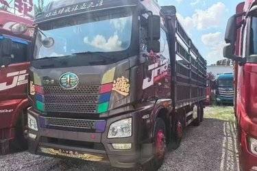 二手青岛解放 JH6重卡 智尊版2.0 460马力 8X4 9.4米仓栅式载货车(速比3.727)(国五) 前四后八 锡柴二手载货车 黄牌图片