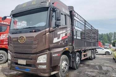二手青岛解放 JH6重卡 领航版2.0 430马力 8X4 9.5米仓栅式载货车(国五) 前四后八 潍柴二手载货车 黄牌图片