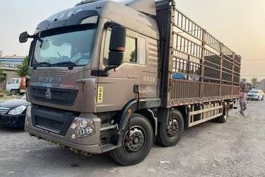 二手中国重汽 HOWO TX重卡 320马力 6x2 9.52米仓栅式载货车(国六) 前四后四 曼二手载货车 黄牌图片