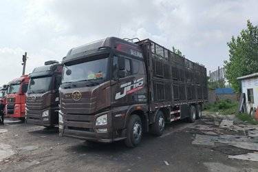 二手青岛解放 JH6重卡 460马力 8X4 9.5米畜禽式载货车(国五) 前四后八 锡柴二手载货车 黄牌图片