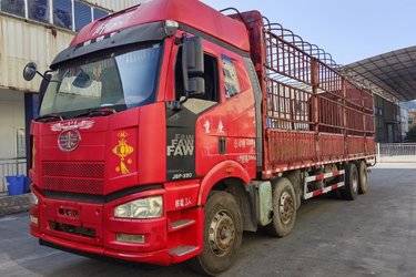 二手青岛解放 JH6重卡 350马力 8X4 9.4米仓栅式载货车(国五) 前四后八 锡柴二手载货车 黄牌图片