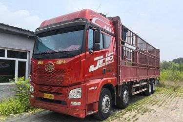 二手青岛解放 JH6重卡 领航版2.0 460马力 8X4 8.6米AMT自动挡仓栅式载货车(国六)(带液缓)(国六) 前四后八 锡柴二手载货车 黄牌图片