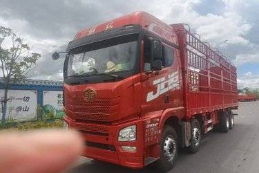 二手青岛解放 JH6重卡 350马力 8X4 9.5米仓栅式载货车(国五) 前四后八 锡柴二手载货车 黄牌图片