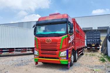 二手青岛解放 JH6重卡 320马力 6X2 9.5米仓栅式载货车(国六) 前四后四 锡柴二手载货车 黄牌图片