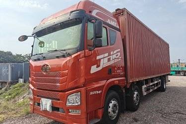 二手青岛解放 JH6重卡 320马力 6X2 9.5米翼开启厢式载货车(国六) 前四后四 锡柴二手载货车 黄牌图片