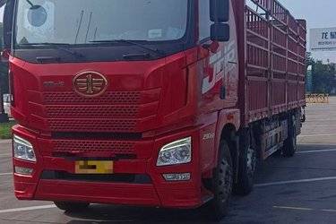 二手青岛解放 JH6重卡 290马力 6X2 9.5米仓栅式载货车(国六) 前四后四 锡柴二手载货车 黄牌图片