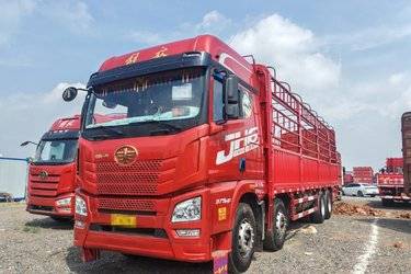 二手青岛解放 JH6重卡 375马力 8X4 9.5米仓栅式载货车(国五) 前四后八 潍柴二手载货车 黄牌
