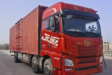 二手青岛解放 JH6重卡 领航版 290马力 6X2 9.4米翼开启厢式载货车(国五) 前四后四 锡柴二手载货车 黄牌图片