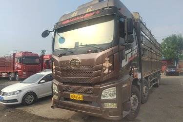 二手青岛解放 JH6重卡 460马力 8X4 9.5米仓栅式载货车(速比3.545)(国五) 前四后八 潍柴二手载货车 黄牌