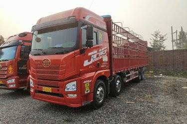 二手青岛解放 JH6重卡 460马力 8X4 9.5米仓栅式载货车(潍柴发动机)(国五) 前四后八 潍柴二手载货车 黄牌